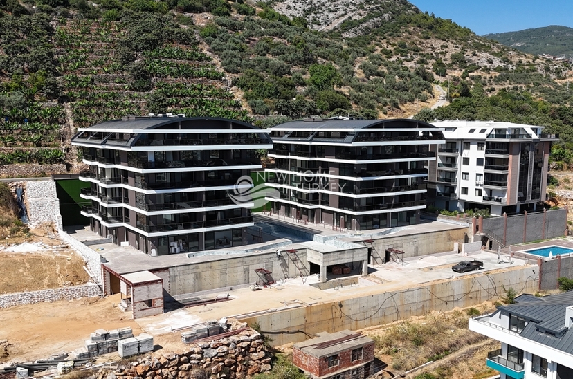 Lyxig 1+1 lägenhet med havs-, slotts- och bergsutsikt i Alanya Center