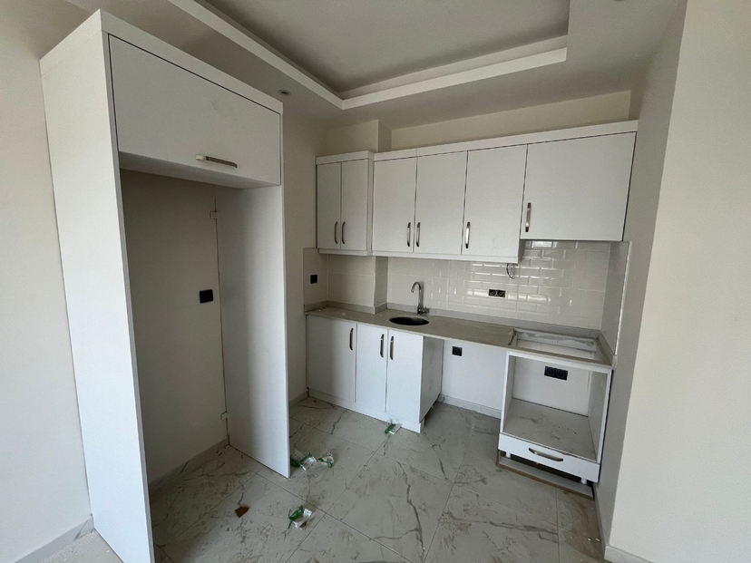 Moderne 1+1 Wohnung mit Bergblick und luxuriösen Annehmlichkeiten