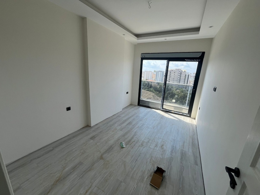 Moderne 1+1 Wohnung mit Bergblick und luxuriösen Annehmlichkeiten