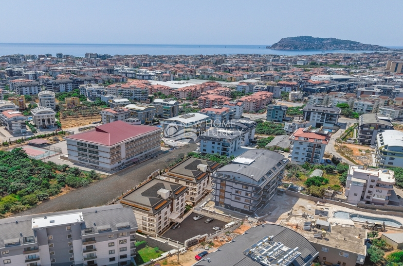 Ylellinen 3+1 puutarhakerroksen huoneisto Alanya-OBA:ssa vuorinäköalalla