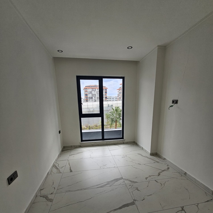 Современная 1+1 квартира с видом на горы в Авсалларе, Алания